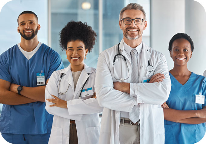 Doctor, team and hospital at work smile together for portrait in medical facility. Medic, nurse and healthcare in clinic with workers showing happiness, confidence and diversity for teamwork.